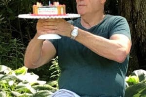 dad at dog party with cake